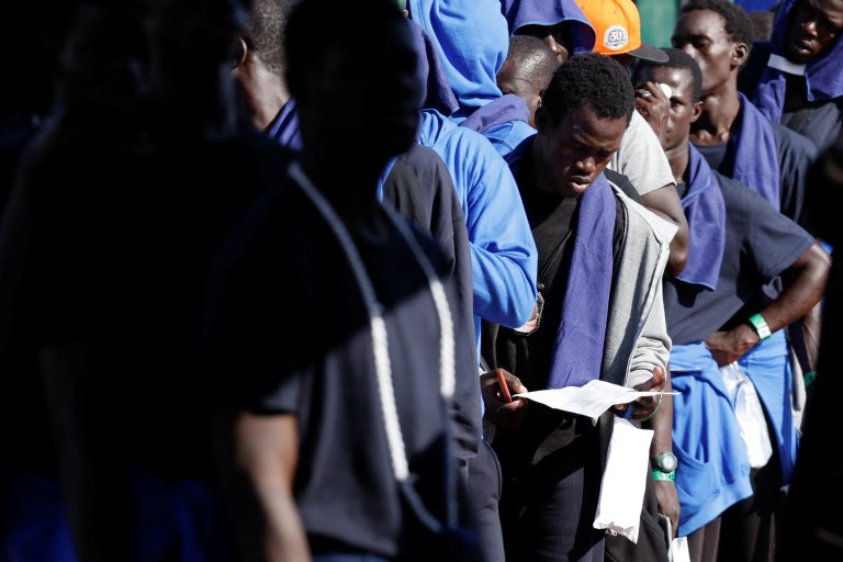 File photo used for illustration: Migrants who have just landed on the Spanish Canary Islands wait in line | Photo: Reuters