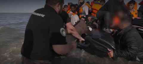 The BBC published a video on July 4, 2025, showing police officers slashing a migrant boat already in the water | Screenshot: BBC