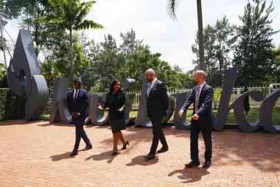 Britain's Home Secretary James Cleverly, centre right, visits the Kigali Genocide Memorial in Kigali, Rwanda on Tuesday, December 5, 2023, as both countries sign a new treaty on asylum seekers | Photo: Ben Birchall/ AP 