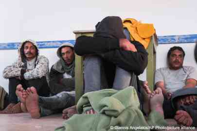 From file: Migrants sit at the port of Paliochora, on the island of Crete after a late night rescue operation by the coast guard near the tiny island of Gavdos, southern Greece | Photo: AP
Photo/Giannis Angelakis