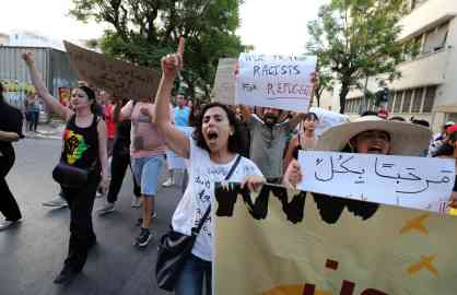 People shouting slogans during a protest in Tunis, Tunisia on July 14, 2023 organized by the Antifascist Front against racist crimes committed against sub-Saharan migrants | Photo: Mohamed Messara/EPA