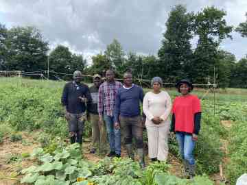 The collective of migrant farmers produces vegetables on about half a hectare of land near Rennes. From left to right: Eddy Valère, Laurent, Kassiri, David, Bena, and Justine | Photo: InfoMigrants