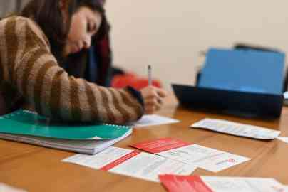 A migrant receives help with filling out forms at an assistance center run by Doctors Without Borders (MSF) in Rome | Photo: MSF