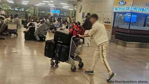 Afghans at Pakistan's Islamabad airport, preparing to board a flight to Germany | Photo: Zia Khan / dpa / picture alliance