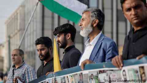 Survivors of the deadly migrant shipwreck, Zahid Akbar, 21, and Inzimam Maqbool, 22, from Pakistan, join a protest calling for justice ahead of the trial, May 20, 2024 | Photo: REUTERS/Louisa Gouliamak
