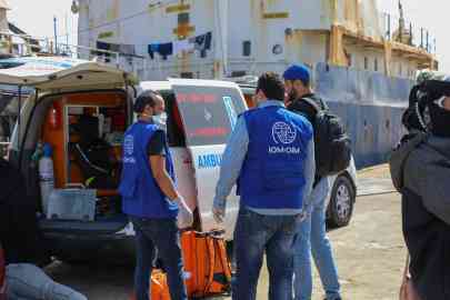 IOM teams providing urgent medical assistance to migrants as they disembark at the Abusita port in Tripoli, Libya | Photo: Moyad Zaghdani / IOM