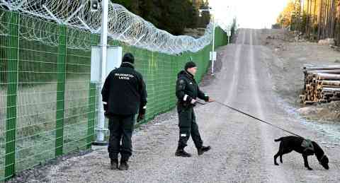 File photo: Border guards and a border dog are seen during a Finnish border guard media event at the border in October 2023 | Photo: Lehtikuva/Jussi Nukari/via Reuters
