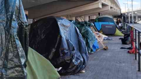 Migrants who were evicted from a former school building in Badalona have set up camp under a bridge nearby, January 2026 | Photo: Judit Alonso