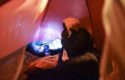 A teen, waiting for the courts to recognize he is underage, under his tent in Paris, March 30. Photo: Mehdi Chebil