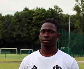 Mamady Sylla poses for an official club photo | Edited photo from TuSpo Saarn via fupa.net / R. Maszun
