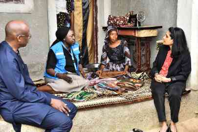 Raouf Mazou and Ruven Menikdiwela speaking with Safiya Musa, an internally displaced person in Maiduguri | Photo: UNHCR