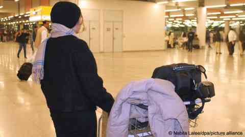 This young Afghan woman is pictured waiting for her flight to Berlin at the airport in Islamabad on November 19, 2025 | Photo: Nabila Lalee/dpa/picture alliance