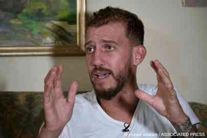 Jihad Michlawi, 31 recounts his experiences to Associated Press at his home in the Beirut suburb of Burj Hammoud, Lebanon, on September 27, 2022 | Photo: Bilal Hussein / picture alliance/AP