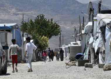 From file: Syrian refugee children walking next to makeshift shelters in a Syrian refugee camp in Lebanon | Photo: Wael Hamzeh / EPA / ANSAMed