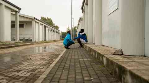 From file: A UNICEF operator with a minor migrant in a shelter center for asylum seekers in Crotone | Photo: UNICEF / Antonioli