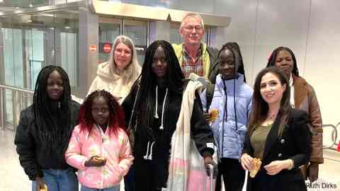 Achol Lual (fourth from the left), her mother and sisters, being picked up at the airport in Hanover by Ruth Dirks (third from left) and others in their NesT mentoring group, in January 2025 | Photo: Ruth Dirks