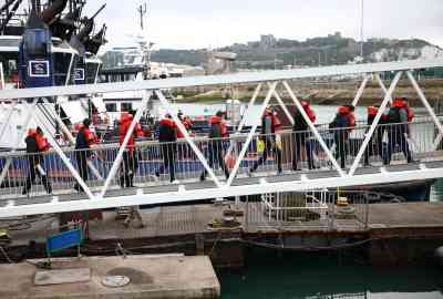 From file: Migrants are escorted into Dover harbour, after being rescued while attempting to cross the English Channel, in Dover, Britain, August 24, 2022 | Photo: Henry Nicholls,/Reuters