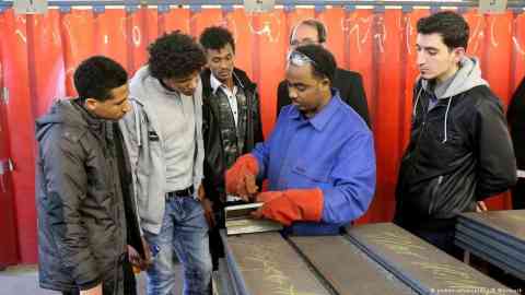 Young migrants at a vocational training in Rostock, Germany | Photo: picture-alliance/dpa/B.Wüstneck
