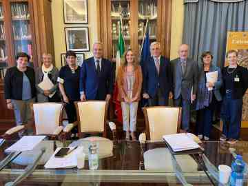 Parties involved in the agreement line up after signing to bring 1,000 refugees to Italy via a humanitarian corridors | Photo: Sant'Egidio