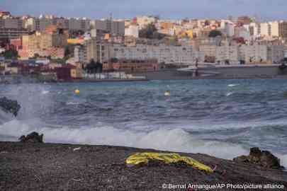 File photo used for illustration: The body of a young man is covered with an emergency blanket after being recovered by Spanish police from waters near the border between Morocco and Spain's north African enclave of Ceuta, Thursday, May 20, 2021. (AP Photo/Bernat Armangue)