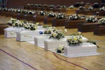 Coffins containing the remains of people who died during the sinking of a migrant boat on February 26, 2023 are stored in a gymnasium in Crotone, Italy. Photo: Reuters