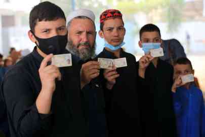 From file: Afghan refugees show their registration cards to renew their Proof of Registration (POR) cards at a Drive (Document Renewal and Information Verification Exercise) site in Peshawar, Pakistan on September 30, 2021 | Photo: Arshad Arbab/EPA