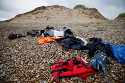 Abandoned belongings and a damaged dinghy on a northern French beach | Photo: Reuters