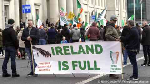 From file: Immigration protest. Protesters take part in the Ireland Says No anti-refugee
gathering outside The Custom House in Dublin | Photo: Niall Carson/PA Wire/picture alliance