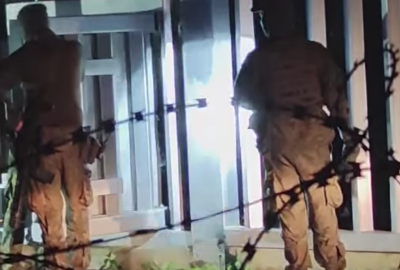 Footage from a video posted by human rights activists from POPH appear to show Polish soldiers opening a door in the fence on its border with Belarus | Source: POPH Facebook