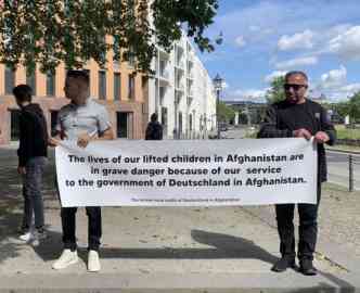 Fathers protest outside the Foreign Ministry in Germany on behalf of their children left in Afghanistan on August 2, 2023. | Photo: Clare Roth