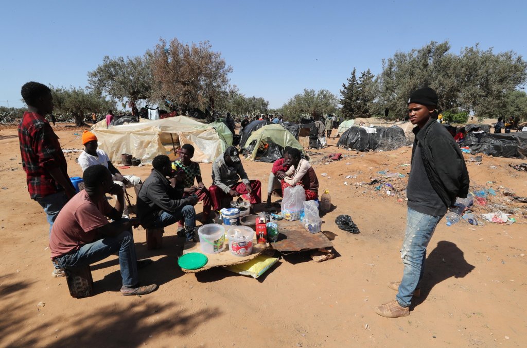 File photo: Sub-Saharan African migrants sitting near tents at a camp in Jebeniana, Sfax governorate, Tunisia | Photo: Mohamed Messara / EPA