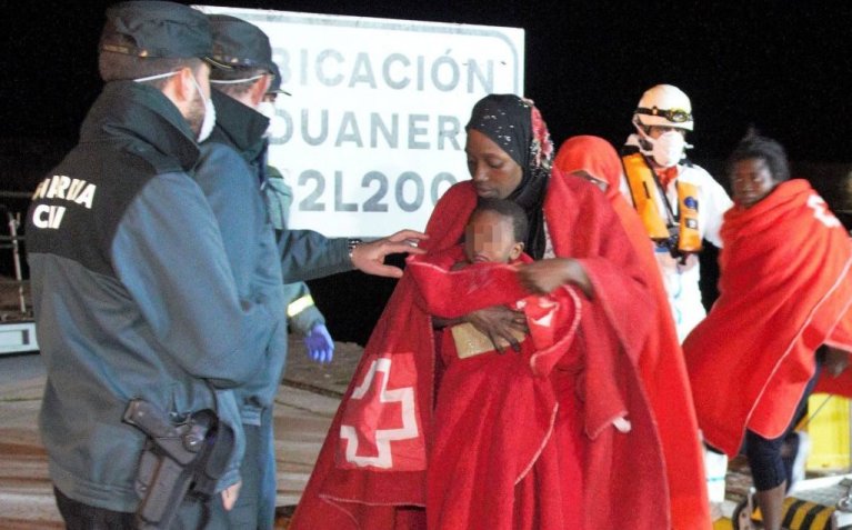 From file: A migrant mother with her child arrive at the port of Motril, southern Spain | Photo: EPA/ALBA FEIXAS