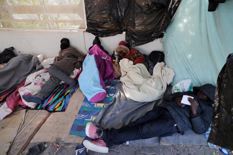 Sub-Saharan African migrants camp outside the headquarters of the International Organisation for Migration (IOM) as they seek shelter and protection amidst attacks on them, in Tunis. March 3, 2023. | Photo credit: EPA / MOHAMED MESSARA