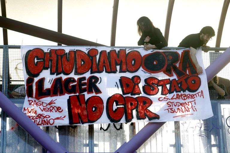 Participants in a demonstration hold a banner against CPRs in Milan on April 6 | Photo: ANSA / MOURAD BALTI TOUATI